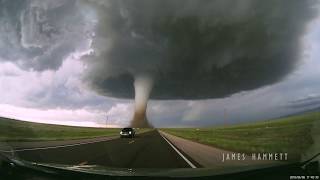 Storm chasing dashcam Tornado crossing the highway Laramie Wyoming [upl. by Sylado]