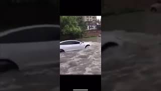 What happens when a Tesla drives through waterflood 🌊🚗😮 [upl. by Brittani]