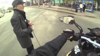 Motorcyclist Helps and old man cross the road in Russia [upl. by Acillegna]