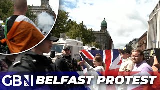 Belfast Antiimmigration protesters fly Tricolour and Union Jack together  Never seen in my life [upl. by Yendirb]