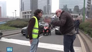 Milano gli attivisti bloccano di nuovo il traffico l’automobista sbotta «Fuori dai c» [upl. by Abdu477]