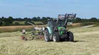 Andainage 2014 avec deutzfahr et un andaineur claas doubles toupies [upl. by Eerej]