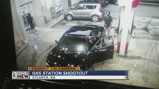 A gas station shootout in Atlanta caught on camera [upl. by Ellenej]