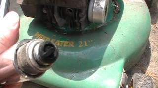 How To Clean Remove Carbon On Old Spark Plug Fix Surging Sputtering Lawn Mower [upl. by Aicirtal]