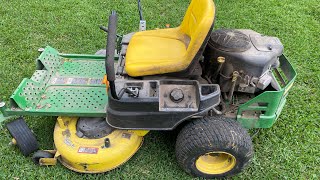 Changing air filter on a John Deere Z335E zeroturn mower [upl. by Eignav621]