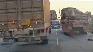 Transporter movie style car cruising in between trucks Mahindra Vs mazda engine coach van Overtake [upl. by Anitsuga36]