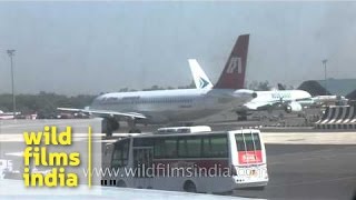 Jet Airways and Air India planes wait on apron of Delhi Airport [upl. by Akima]