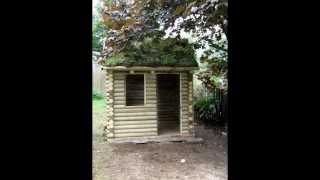 Hand made traditional log cabin playhouse with grass roof part 1wmv [upl. by Dahsar95]