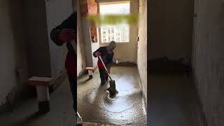 The process of leveling foam concrete in the bathroom with a shovel [upl. by Ailsa532]