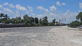 Brightline northbound across the Jupiter Drawbridge over the Loxahatchee River [upl. by Lonyer]