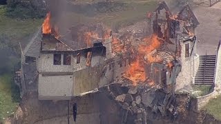 Burning down the house Texas family burn down luxury home that hangs over 75ft cliff [upl. by Kubis]