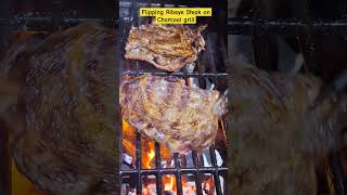 Flipping Ribeye Steak on a Charcoal Grill flipping ribeyesteak grilling shortsfeed shorts [upl. by Rebmyt]