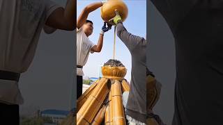 Installation process of gourdshaped decorative parts on the pavilion roof [upl. by Oeramed]