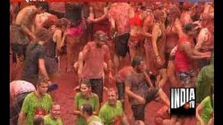 Revellers pay to pelt tomatoes at Spains Tomatina festival [upl. by Etolas985]