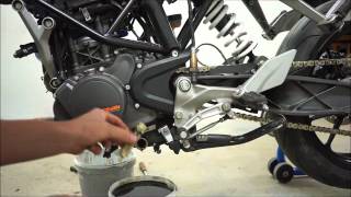 Oil and filter change on the KTM Duke 125 Sony a6000 [upl. by Anerbas165]