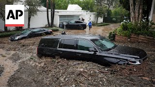 California rain Cars buried in mudslide dramatic river rescue caught on camera [upl. by Lleynad]