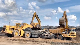 Clark 475C and PayHauler 350Cs with bottom dump trailers working on highway project [upl. by Dis]