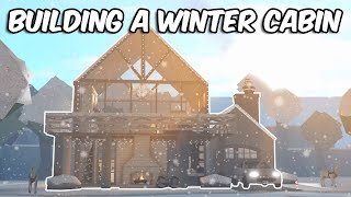 BUILDING A SNOWY WINTER CABIN IN BLOXBURG [upl. by Annaor]