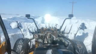 Plowing snow in a road grader [upl. by Enelak]