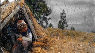 Surviving in extreme weather sun rain cold and a lot of wind Bushcraft Camping in the rain [upl. by Larrie840]