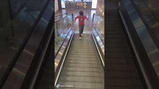 The funniest little boy knee down on the escalator 🤣 shorts [upl. by Evan]