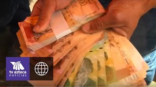 Devaluación en Venezuela billetes no valen para comprar bienes [upl. by Feodore]