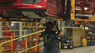 Fords Factory Workers Outfitted With Exoskeletons [upl. by Kcor695]