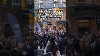 Selena Gomez trips and almost falls while photographed selenagomez selenators tiff emiliaperez [upl. by Teahan]