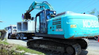 Kobelco Excavator Truck Unloading And Installing Precast Box On The Storm Drain Construction [upl. by Gusty654]