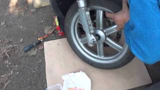 FRONT WHEEL REMOVAL INSTALLATION APRILIA SPORTCITY 125 [upl. by Tudela]