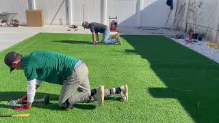 Laying and Nailing Artificial Grass  How to Install Artificial Turf [upl. by Nogem]