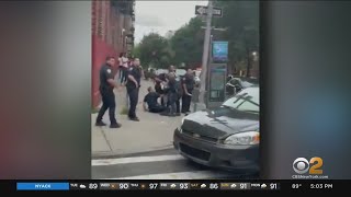 Video shows crowd throwing bottles at cops in the Bronx [upl. by Culhert]