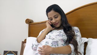 Beautiful pregnant woman giggling and blushing while talking o  Indian Stock Footage  Knot9 [upl. by Bronwyn]