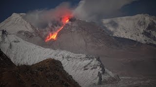 Shiveluch volcano lava dome at night Glowing rockfalls descend flanks of growing dome [upl. by Emili549]