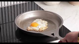 Watch an egg slide off Solidteknics new light stainless steel pans [upl. by Atirb654]