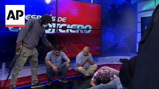 Armed men storm Ecuador TV studio during live broadcast [upl. by Dolan]