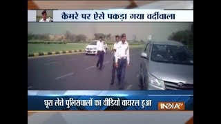 Delhi Traffic police official caught on camera taking bribe [upl. by Marta]