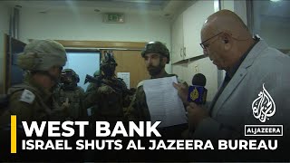 Israeli army raids and shuts down Al Jazeera’s West Bank bureau [upl. by Nnyl]