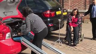 How to get an electric folding wheelchair into a car using ramps  customer demo [upl. by Ennirac]