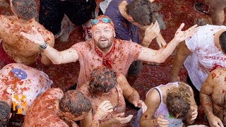 La Tomatina  Festival Discoveries  World Nomads [upl. by Letnohs]