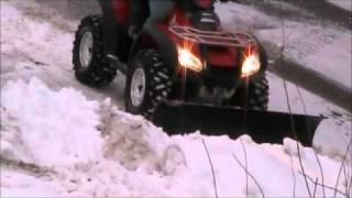 ATV snow plowing Warn plow [upl. by Cinamod185]