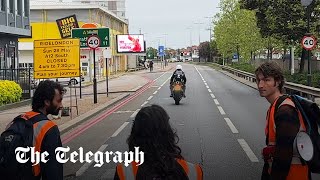 Moment motorcyclist rams past Just Stop Oil protesters blocking the road [upl. by Philps836]