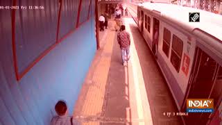 Watch Cop saves man who got stuck on railway track in Mumbai [upl. by Ennayr]