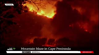 Firefighters working to control blaze on the mountains above Simons Town in Cape Peninsula [upl. by Ardeahp160]