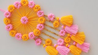 DIY Easy Woolen Flower wall hanging craft ideasWoolen wall hangingWoolen craftWoolen torantoran [upl. by Aihsena]