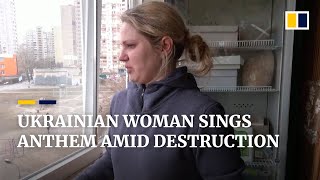 Ukrainian woman sings national anthem in bombedout Kyiv flat [upl. by Asnarepse]