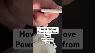 How to remove a Powerstrips by Tesa You pull it straight Dont try to peel it off [upl. by Anippesuig]