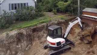 Bobcat E45 Digging Up Big Stump [upl. by Yna369]