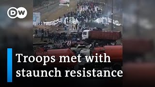 Footage shows how citizens try to stall Russian forces all over Ukraine  DW News [upl. by Ycniuq]