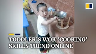 Chinese toddler’s wok ‘cooking’ skills trend online [upl. by Llerrit]